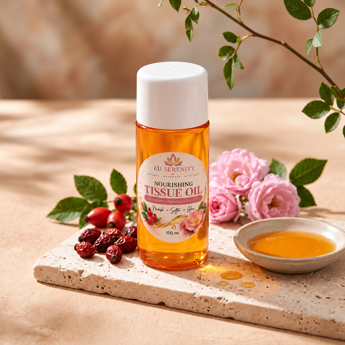 Nourishing Tissue Oil with pink roses, dried rosehips and a dish of golden oil