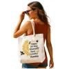 Luxury rope bag with sunflower and bee design, carried at the beach