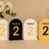 White acrylic table number with gold lettering
