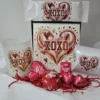 Affordable Valentine’s sweet gift box with chocolates, heart-shaped sweets, tumbler, and XOXO-themed packaging