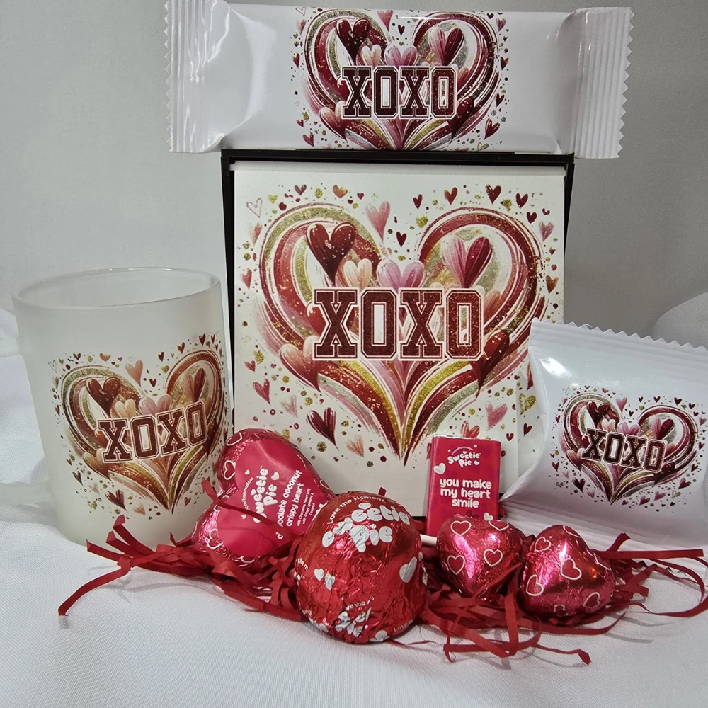 Affordable Valentine’s sweet gift box with chocolates, heart-shaped sweets, tumbler, and XOXO-themed packaging