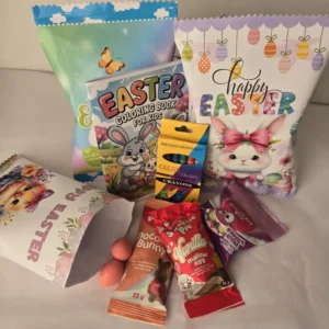Personalised Easter Activity Treat Pack with colouring book, crayons, chocolate bunny, marshmallow eggs and Sweetie Pie sweets in festive Easter bags