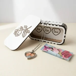 Personalised heart locket necklace with photo inside displayed with wooden gift box and Mother’s Day sweet