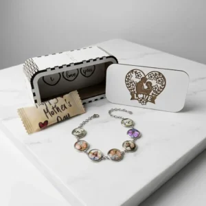 Personalised Mother’s Day charm bracelet with photo charms displayed with wooden gift box on marble background