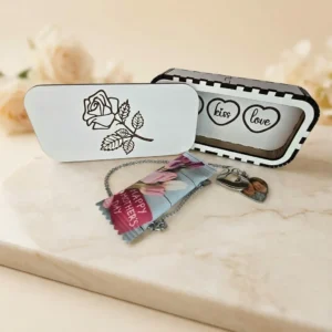 Close-up of personalised heart locket necklace with photo inside and gift packaging